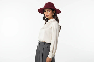 A pakistani girrl wearring marroon fedora hat without any rribon on it - vertical image with whiite background - model photo shot